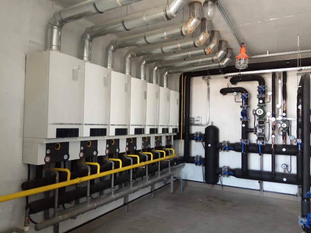 Oak Grove technician on a commercial rooftop unit