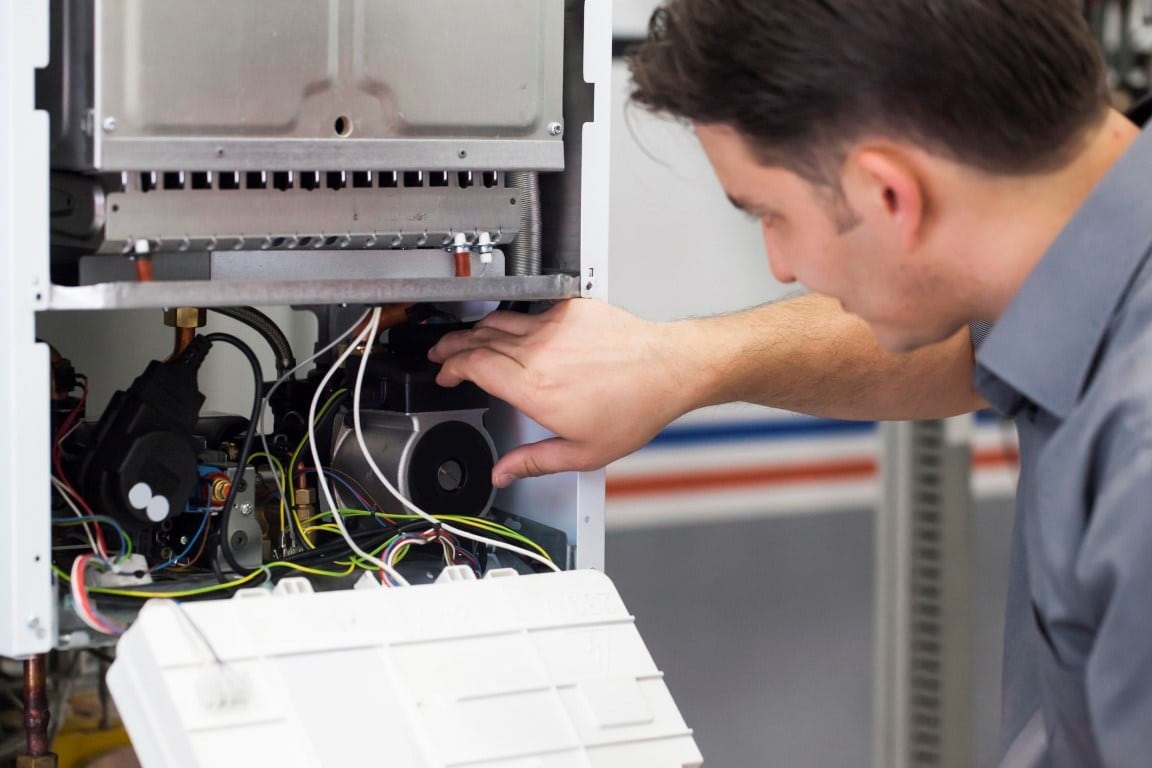 Oak Grove technician diagnosing a furnace